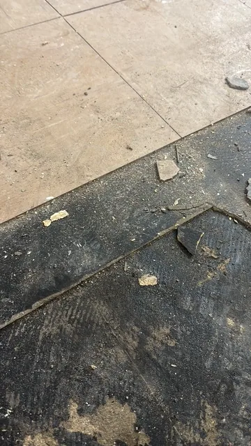 Black bitumen mastic floor removal in a SE14 flat